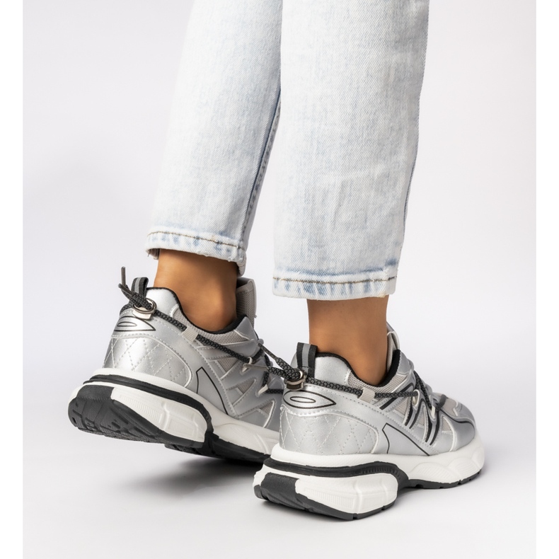 Women's silver sneakers on the platform 1