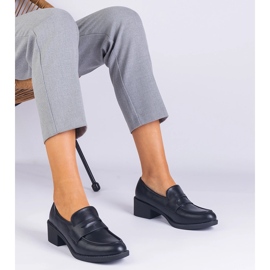 Black eco -leather pumps on a low post 1 Black eco -leather pumps on a low post 1