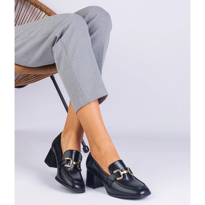 Black pumps on the post with a metallic decoration 1