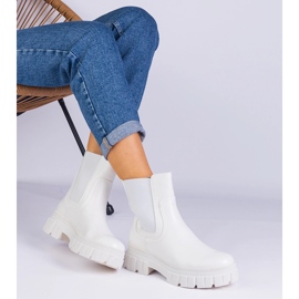 White ankle boots with a flexible insertion 1