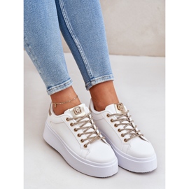 Sneakers on a platform with decorative laces white and gold 1
