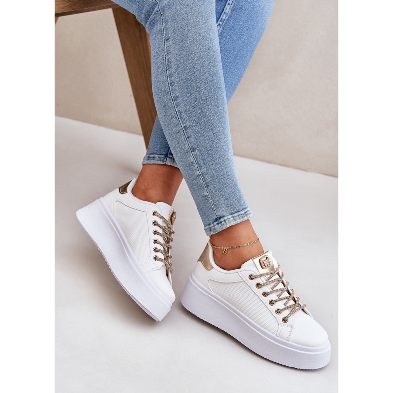 Sneakers on a platform with decorative laces white and gold 2