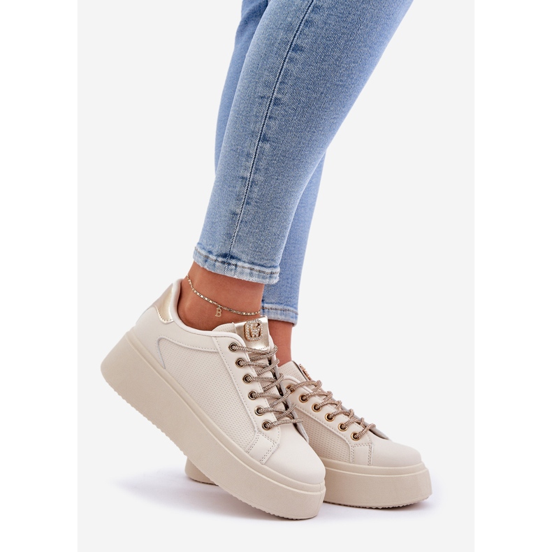 Sneakers on a platform with decorative strings beige 1