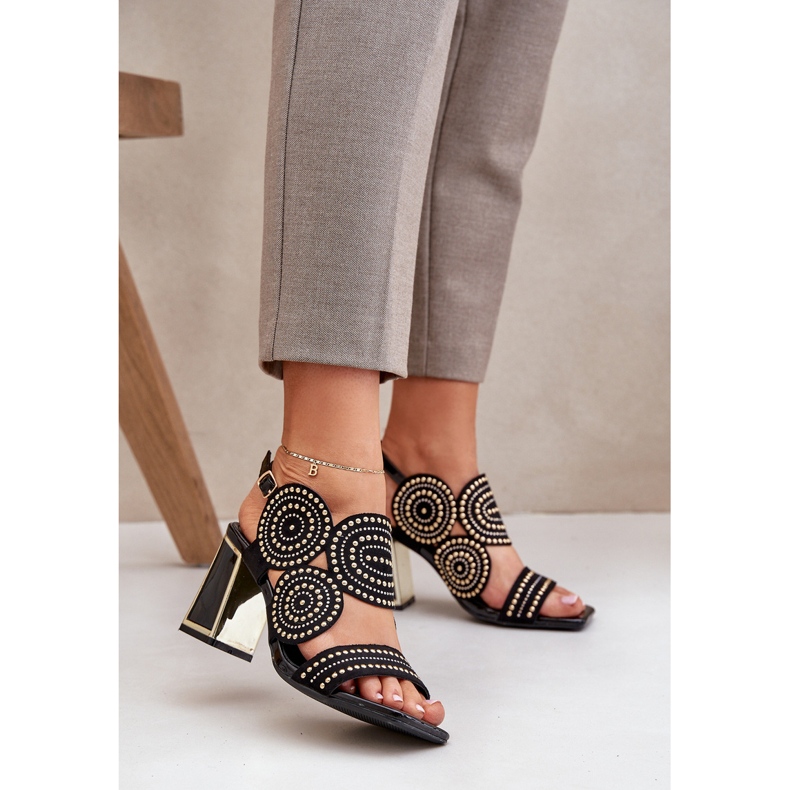 Decorated sandals on the black post 2