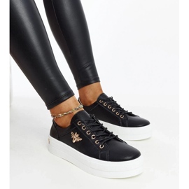 Black leather sneakers on the thick sole of Mikka 2