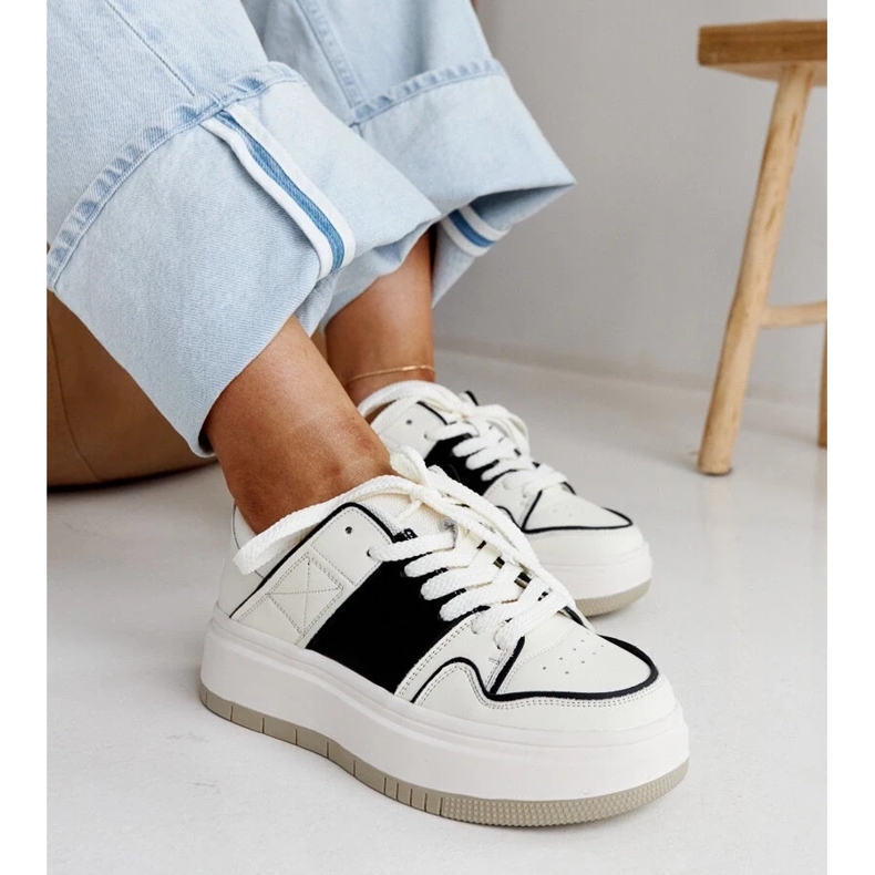 White and white leather sneakers on the thick sole of Abrar 1