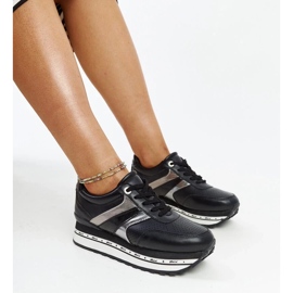 Black sneakers on the high sole of Mehari 1