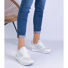 Women's white sneakers on the platform 1