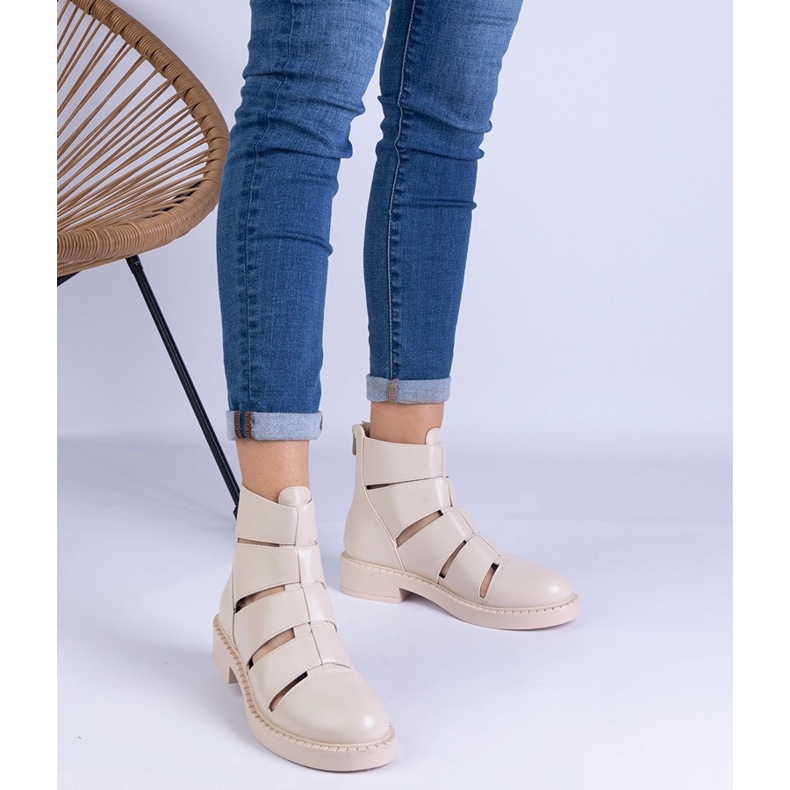 Beige boots made of eco -leather with flat -heeled cutouts 1 Beige boots made of eco -leather with flat -heeled cutouts 1