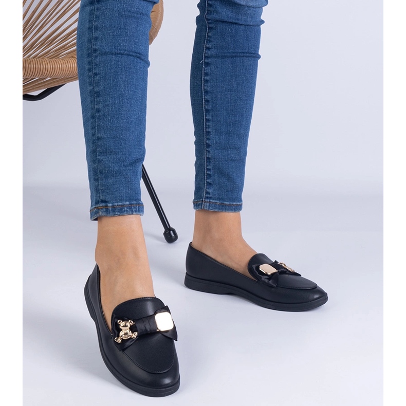 Black loafers decorated with a bow and a golden teddy bear 1