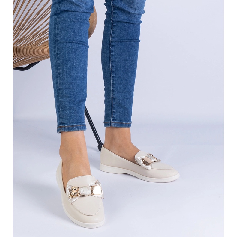 Beige loafers decorated with a bow and a golden teddy bear 1