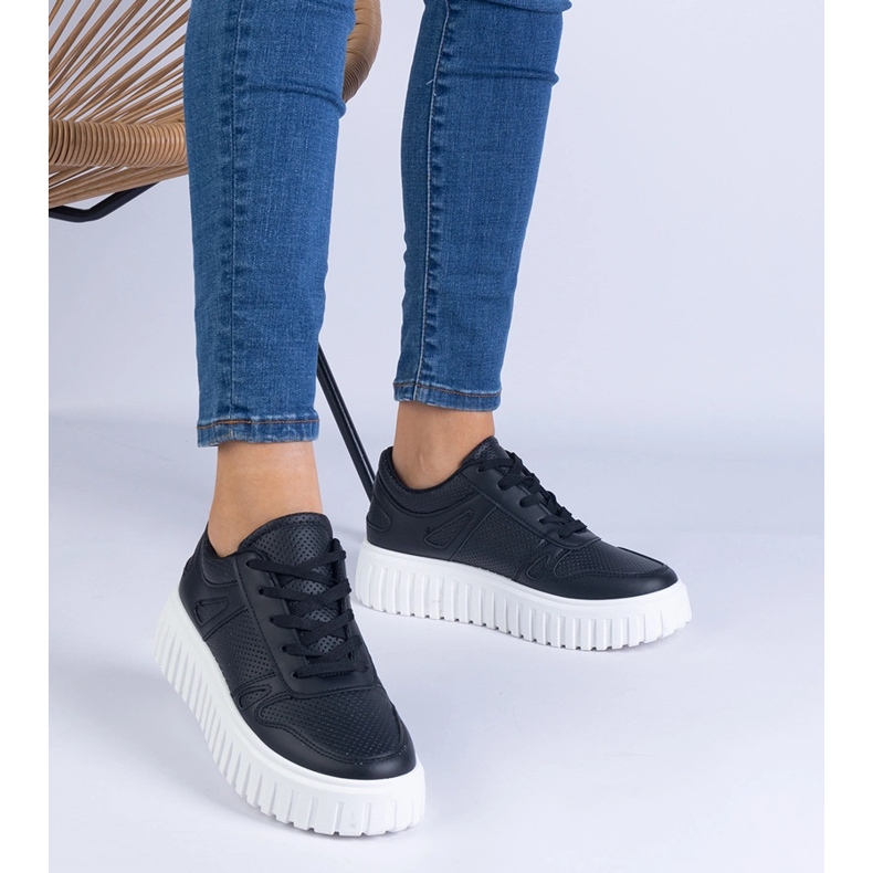 Black openwork sneakers on a massive sole 1