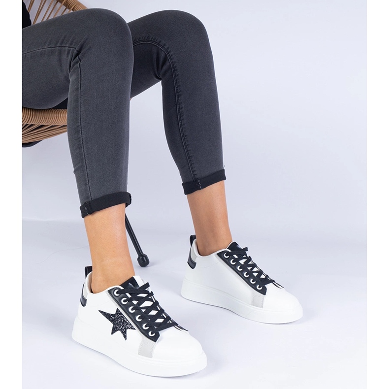 White sneakers decorated with a glitter star 1