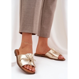 Flat sole flip flops with a decorative gold bow golden 2