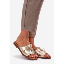 Flat sole flip flops with a decorative gold bow golden 1