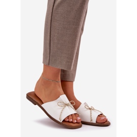 Flat sole flip flops with a decorative bow white 1