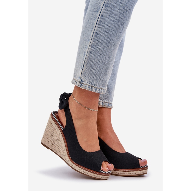 Black sandals on a wedge heel with a braid 1