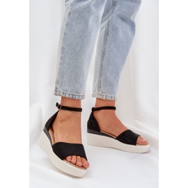 Light sandals on the platform and delicate black wedges 2