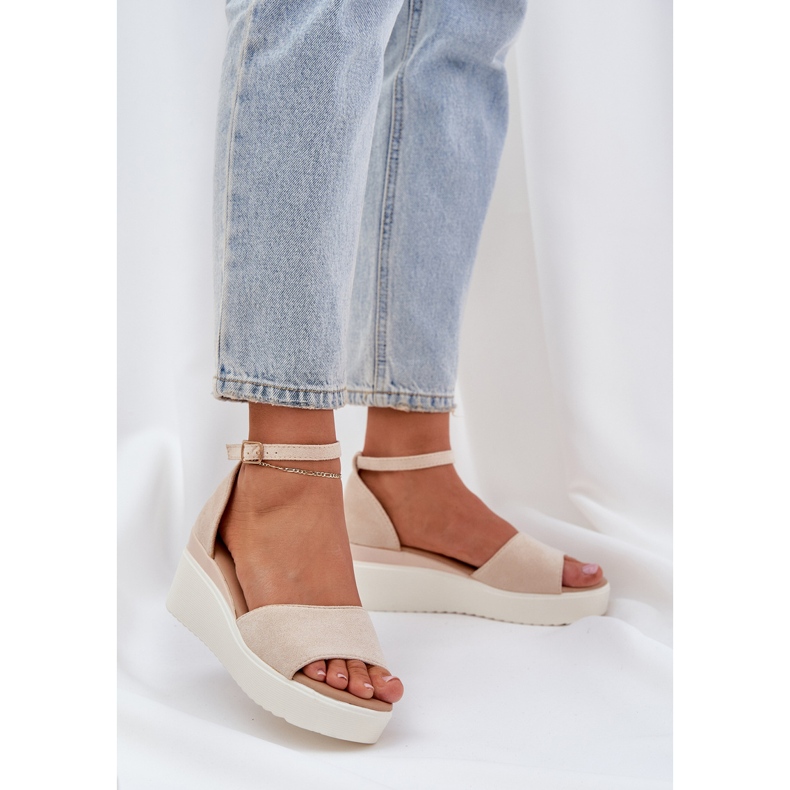 Light sandals on the platform and delicate bright beige wedges 2