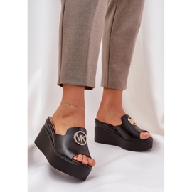 Slippers on the platform and wedges with a black decoration 2