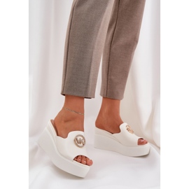 Slippers on the platform and wedges with a white ornament 2