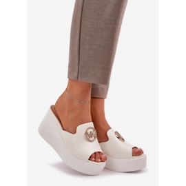 Slippers on the platform and wedges with a white ornament 1