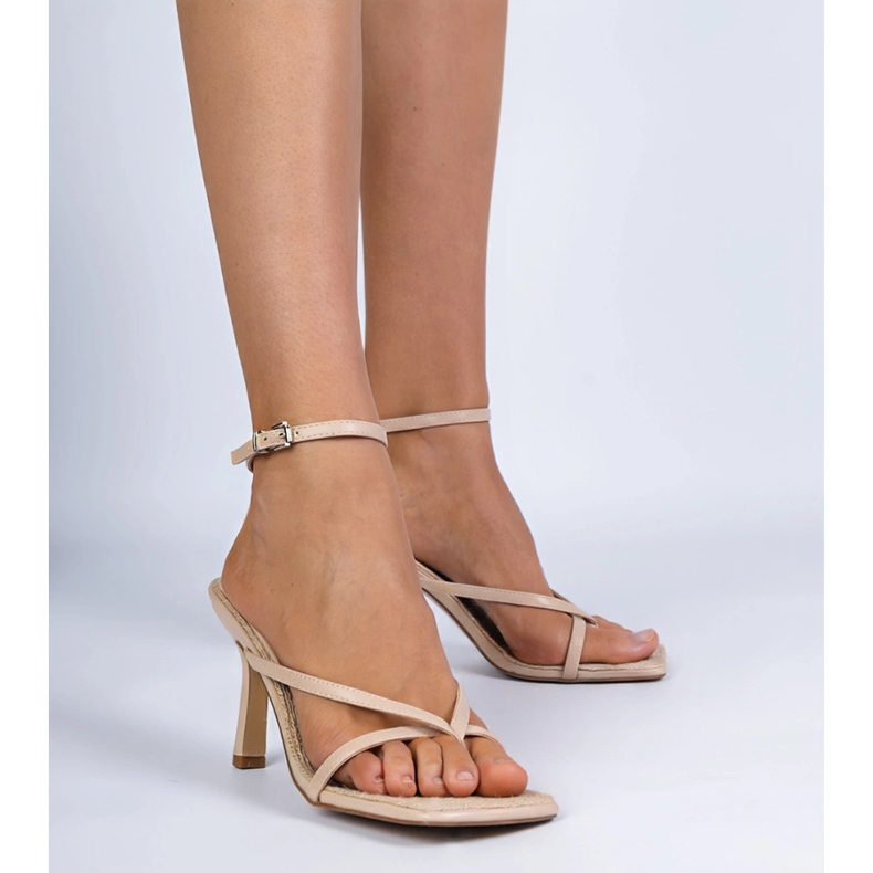 Beige sandals of flip -flops on a high heel 1