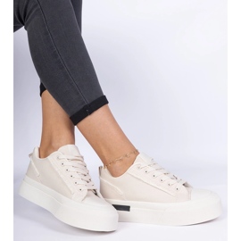 Beige women's material sneakers on the platform 1