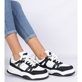 Black and white sneakers with thick laces 1