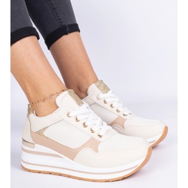 Beige sneakers decorated with glitter and a metal insertion 1