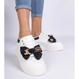 Black sneakers decorated with a bow and a golden teddy bear 1 Black sneakers decorated with a bow and a golden teddy bear 1