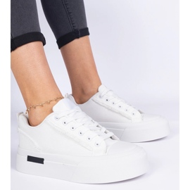 White women's material sneakers on the platform 1