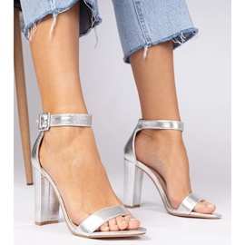 Silver metallic sandals on the post fastened on the ankle 1