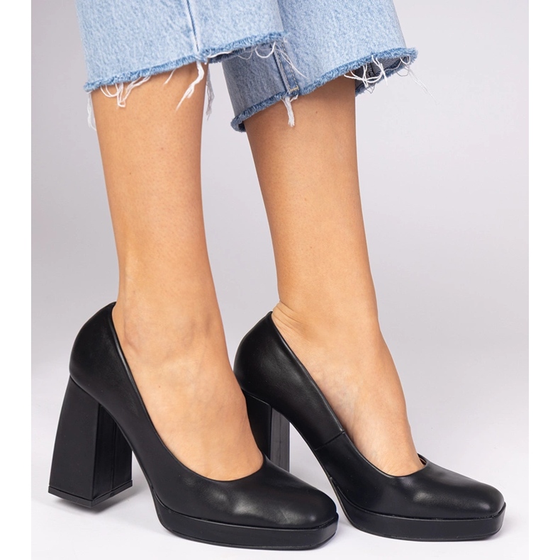 Black pumps on a massive post with a square toe 2