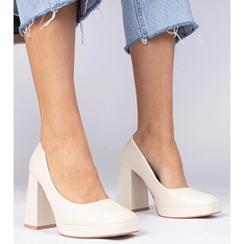 Beige pumps on a massive post with a square toe 1