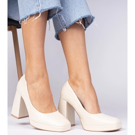 Beige pumps on a massive post with a square toe 2