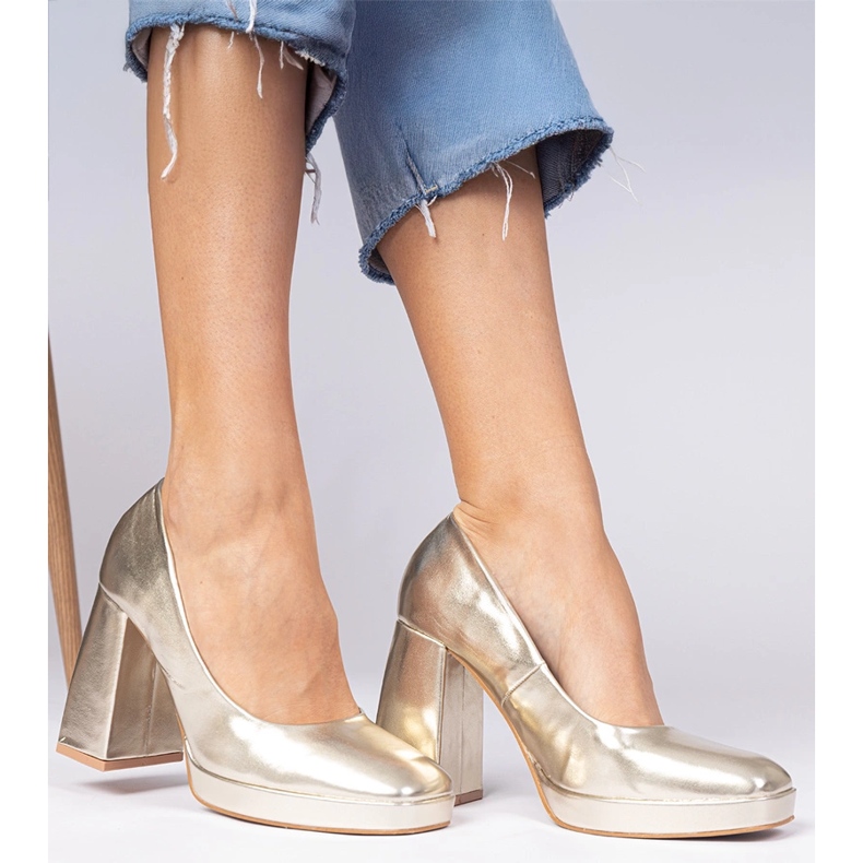 Golden metallic pumps on a massive post with a square toe 2