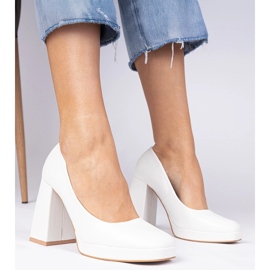 White pumps on a massive post with a square toe 1