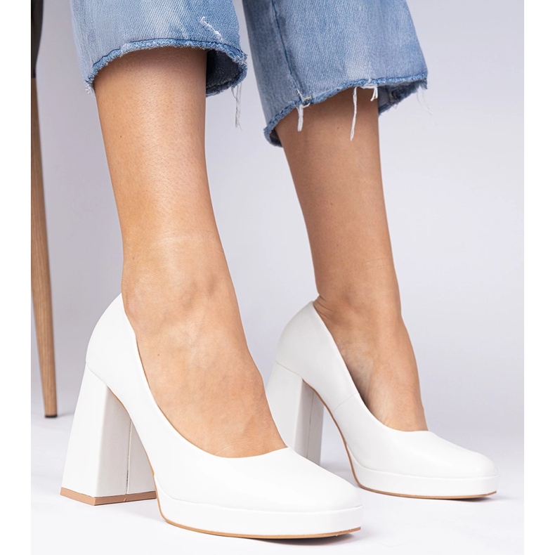 White pumps on a massive post with a square toe 1