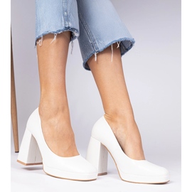 White pumps on a massive post with a square toe 2