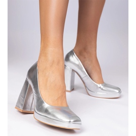 Silver metallic pumps on a massive post with a square nose and 1