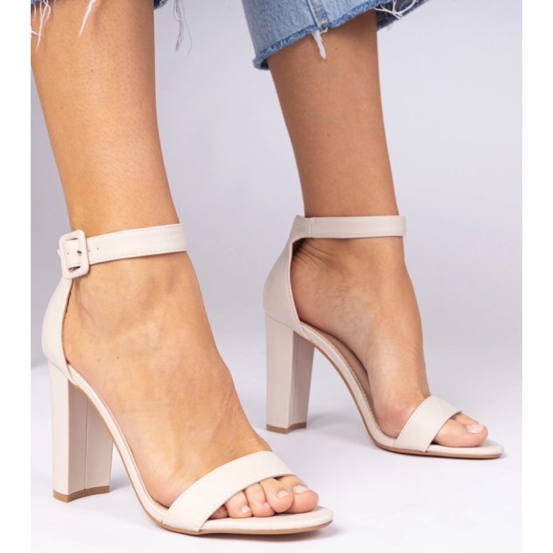 Beige sandals on the post fastened on the ankle 1