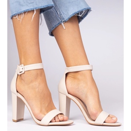 Beige sandals on the post fastened on the ankle 2