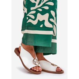 Flat elegant sandals with a white decoration 1