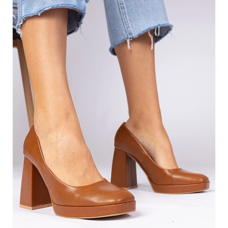 Brown pumps on a massive post with a square toe 1