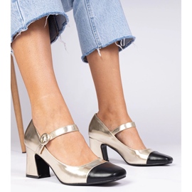 Golden women's pumps with a black nose 1 Golden women's pumps with a black nose 1