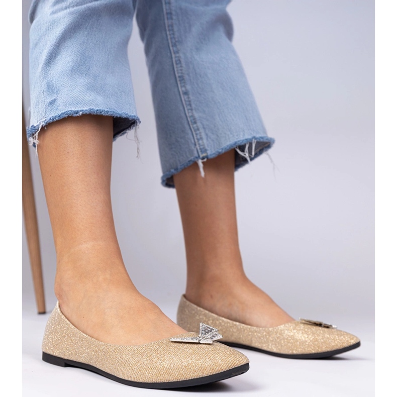 Golden women's glitter ballerinas with a butterfly 1