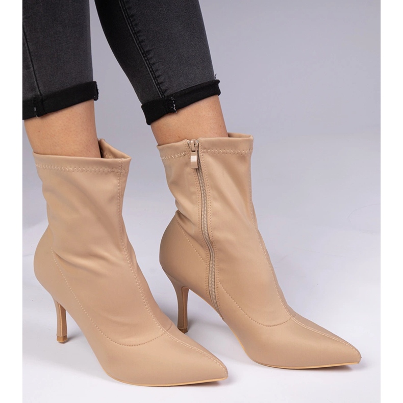 Beige boots with a satin finish on a pin 1 Beige boots with a satin finish on a pin 1