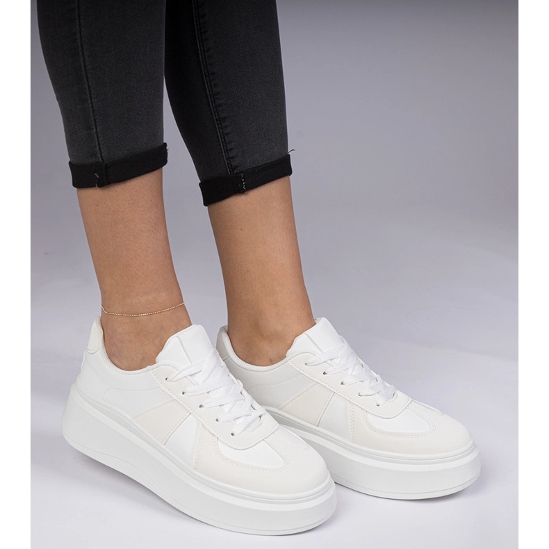 White sneakers sneakers on the platform 1