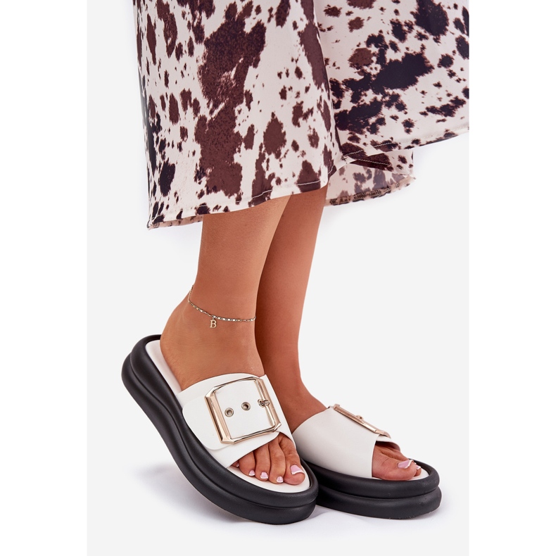 Women's flip flops on a massive platform with a decorative white buckle 1